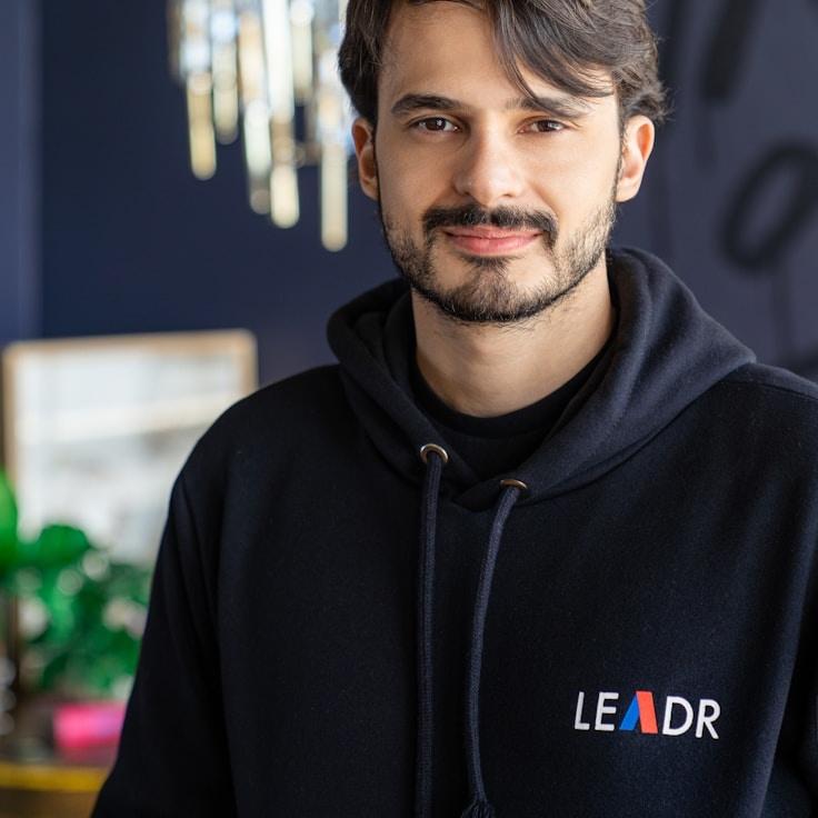 Kaveri Mehta, Lead Design Curator at BridgeSproutMirror, reviewing corporate floral arrangements